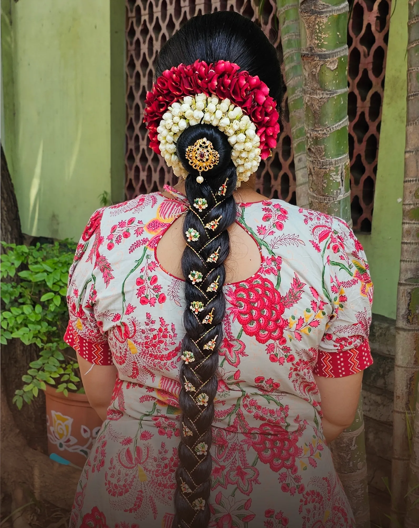 Bridal braid decorated with jasmine and roses