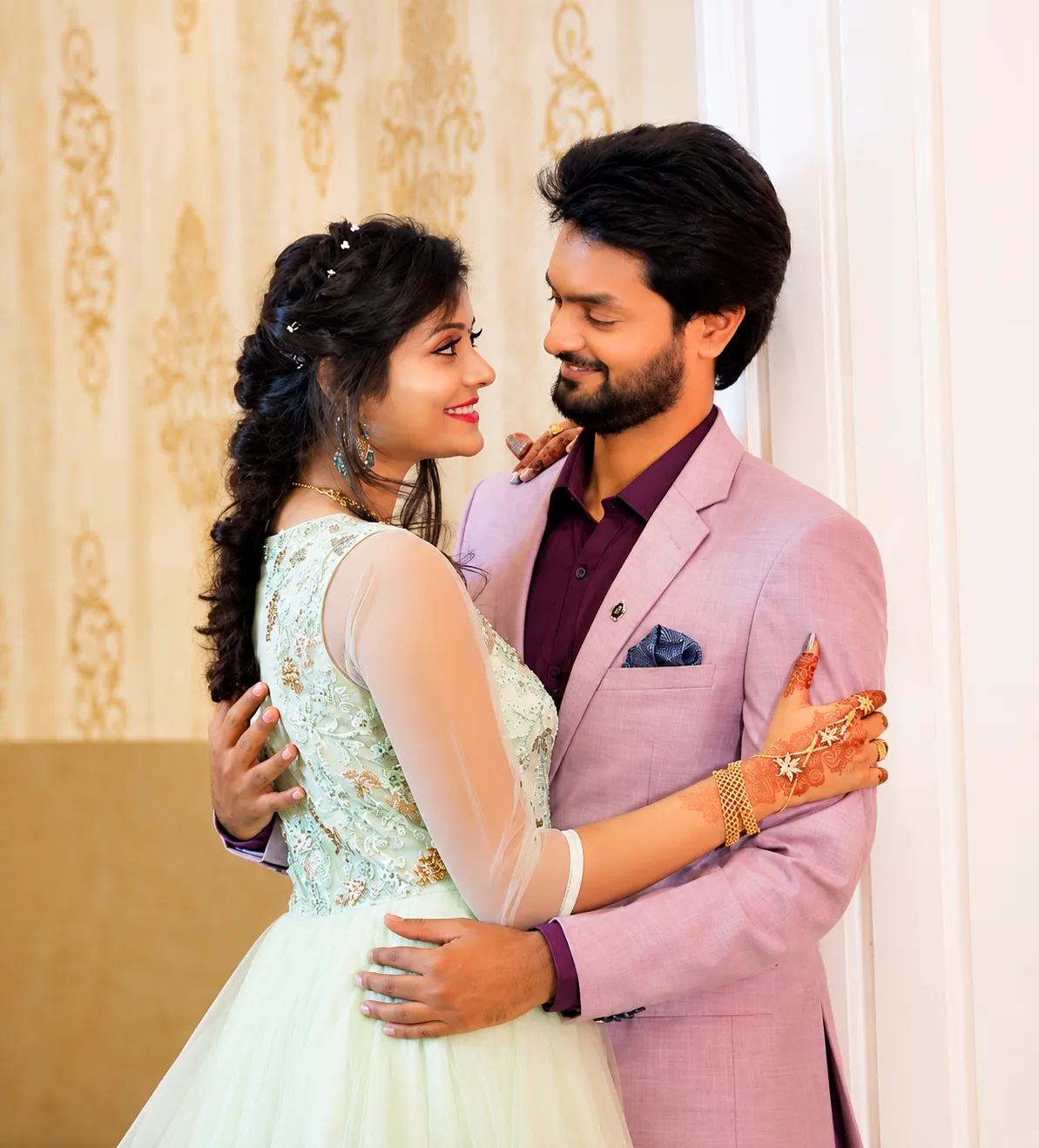 Bride and groom posing together at their reception