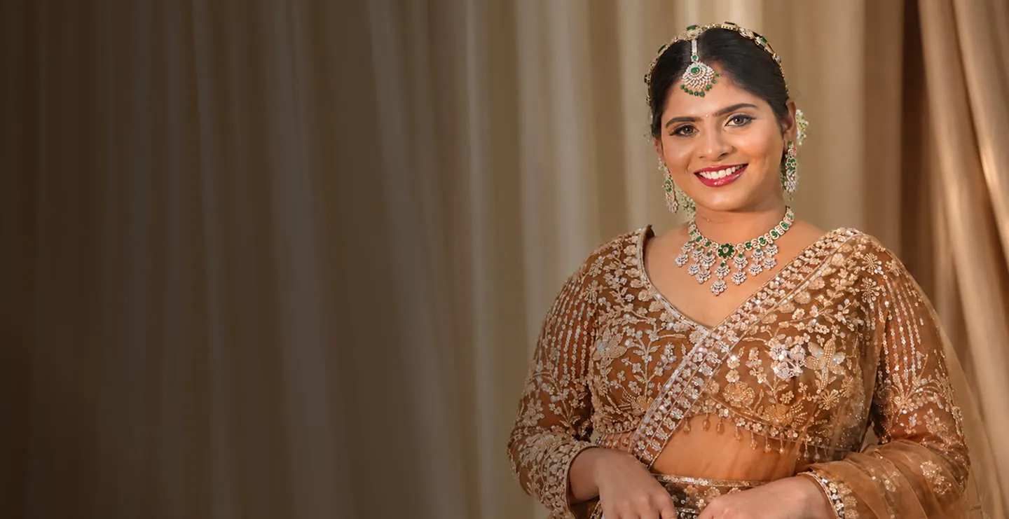 Smiling bride in a gold embellished lehenga